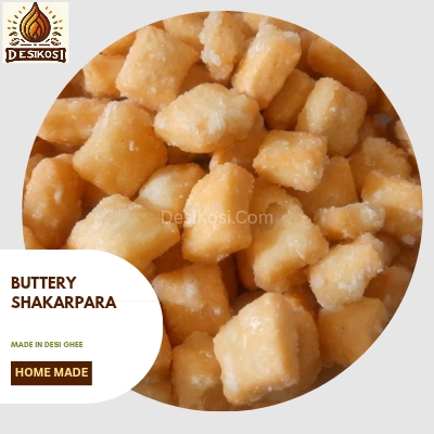 A bowl of golden brown Shakarpara pieces, a crispy Indian sweet snack